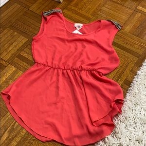 Coral blouse with shoulder detail